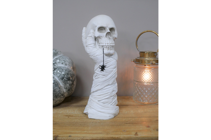 Hand Holding Skull